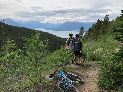photo of two bikers on their way up Mountain hero